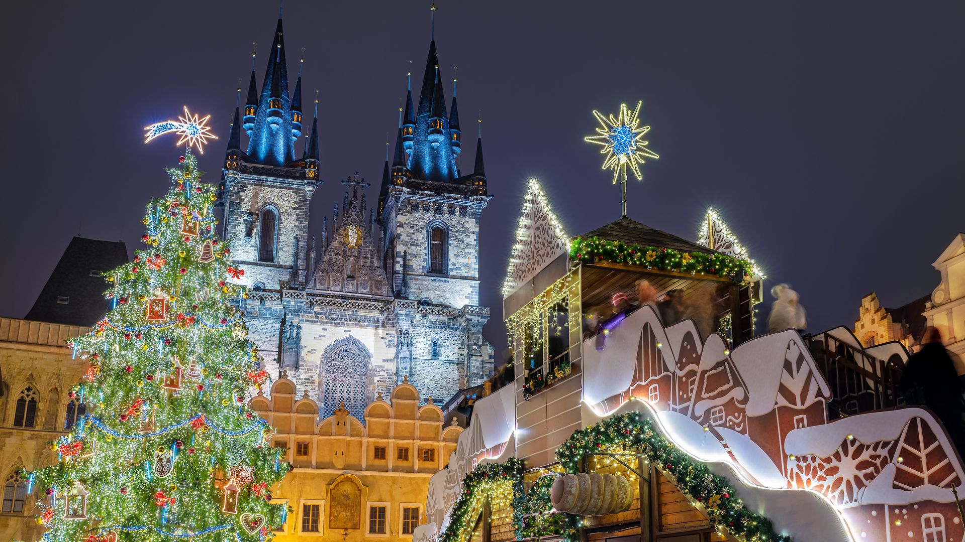 Prague – Prague Old Town Square Christmas market with illuminated Christmas tree at dusk